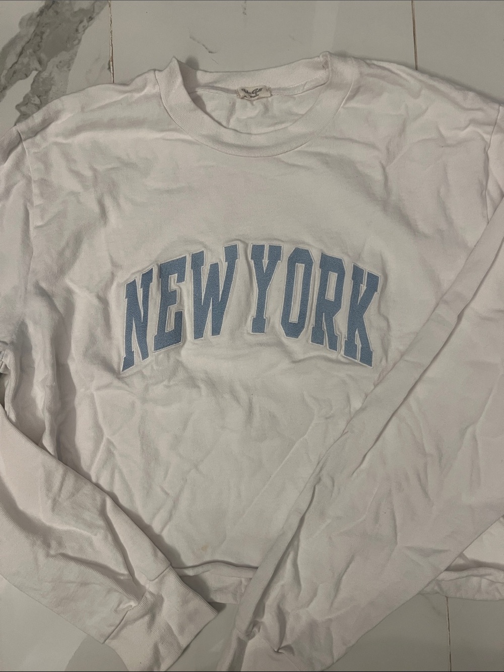 John Galt White Long Sleeve Crewneck Tee with 'NEW YORK' Blue Lettering